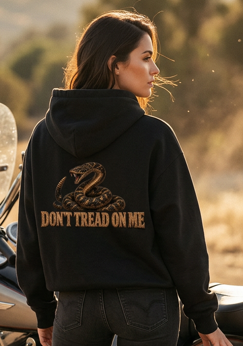 Back view of a woman wearing the black HawgDogs Don't Tread Doggo Ultimate Fleece-147 Hoodie with the coiled rattlesnake graphic