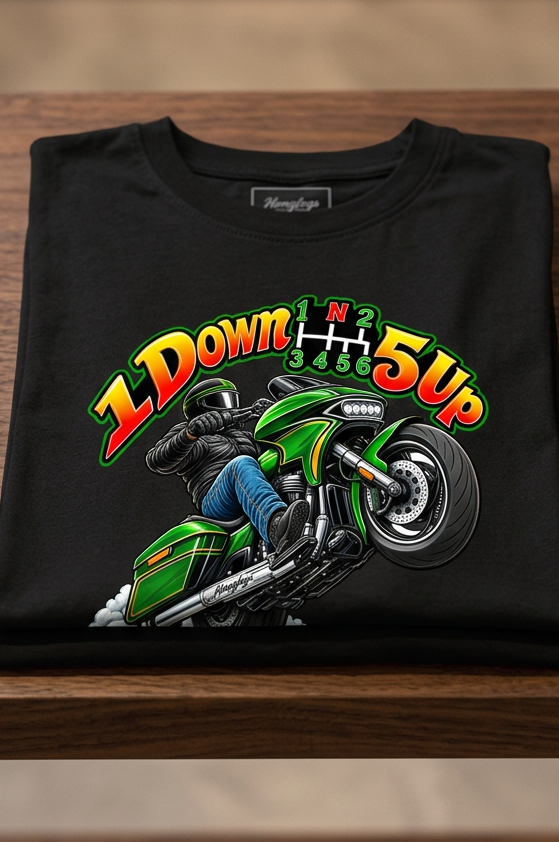 Front of the black Wild Wheelie 1 Down 5 Up men's tank top with the green wheelie motorcycle graphic, laid flat on a wooden table