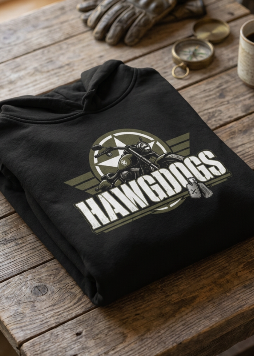 Back of the black Might of The Republic premium hoodie with the HawgDogs logo, folded on a wooden table