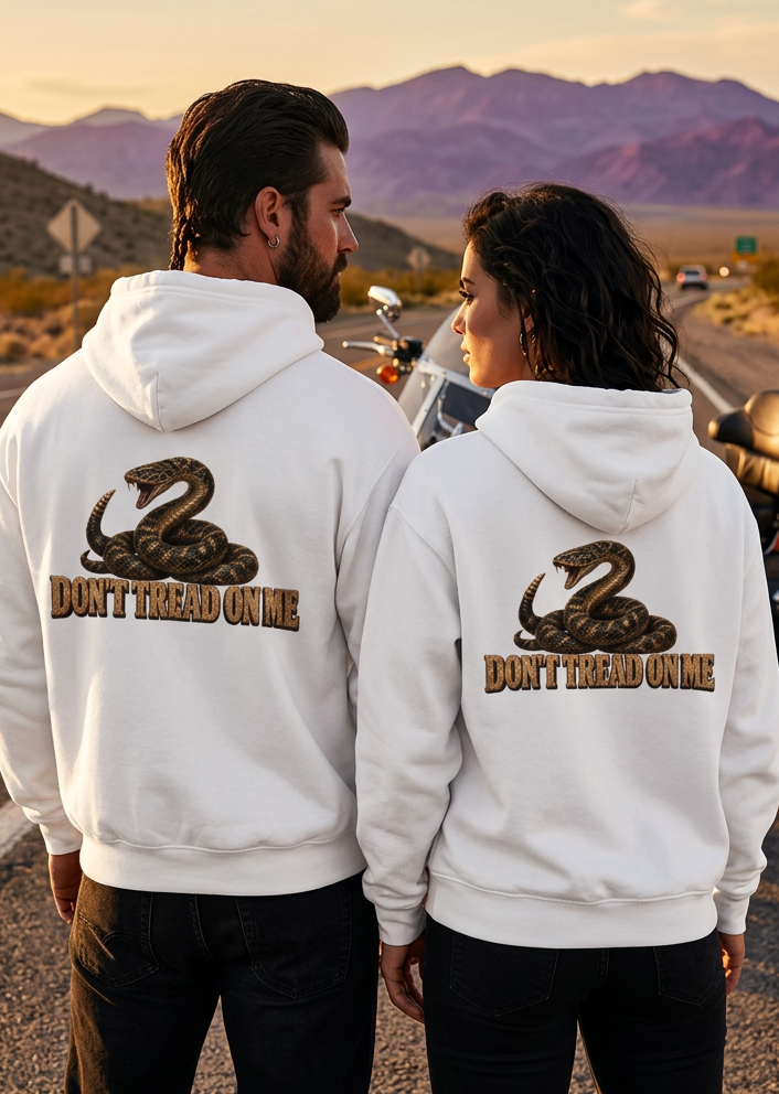 Back view of a couple wearing white HawgDogs Don't Tread Doggo Ultimate Fleece-147 Hoodies with the coiled rattlesnake graphic