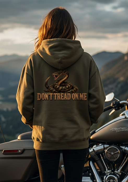 Back view of a woman wearing the olive green HawgDogs Don't Tread Doggo Ultimate Fleece-147 Hoodie with the coiled rattlesnake graphic