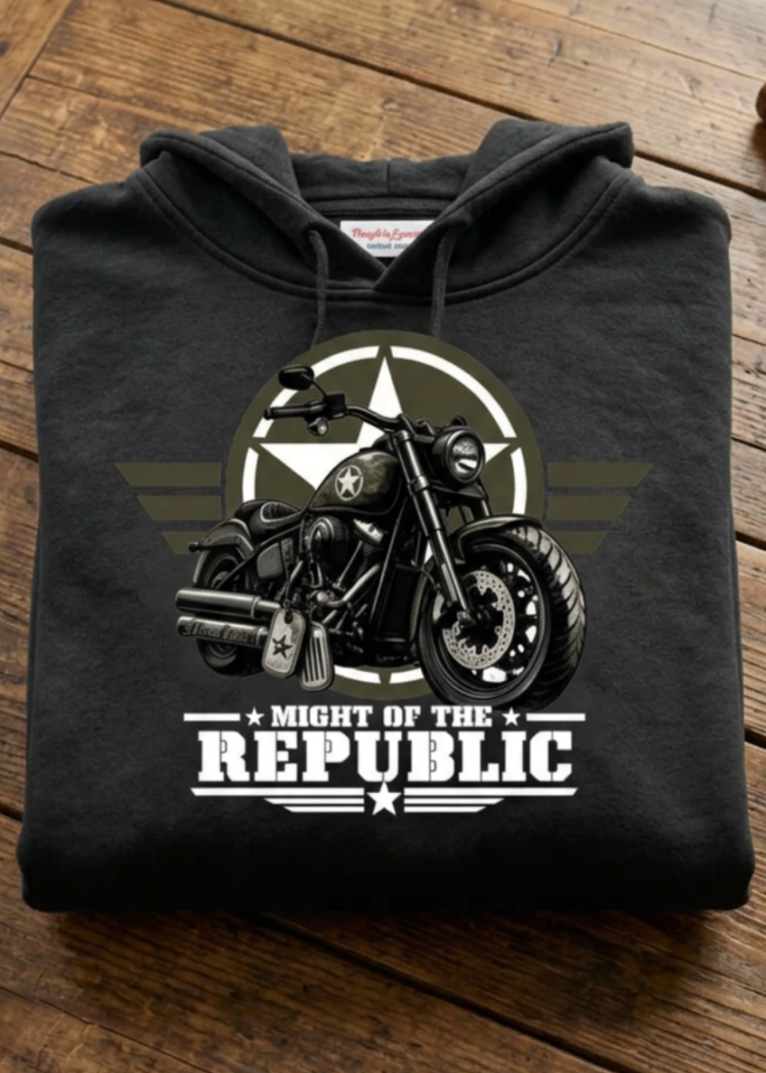 Front of the black Might of The Republic premium hoodie with the Might of The Republic graphic, laid flat on a wooden table