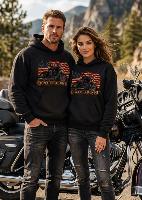 Couple by a motorcycle wearing black HawgDogs Don't Tread Doggo Ultimate Fleece-147 Hoodies showing the front flag biker graphic