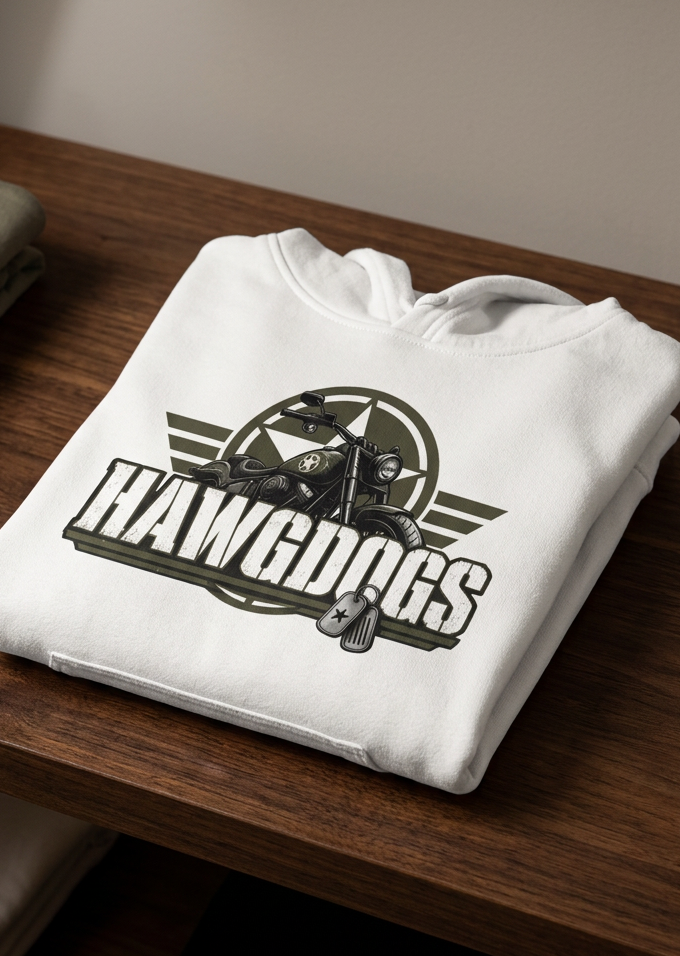 Back of the white HawgDogs Might of The Republic Men's Hoodie with the HawgDog Detroit emblem, folded on a wooden table