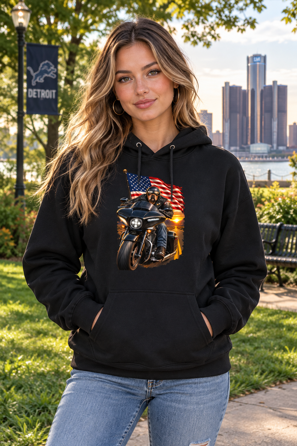 Woman in the black American Dog hoodie with the Detroit skyline behind her