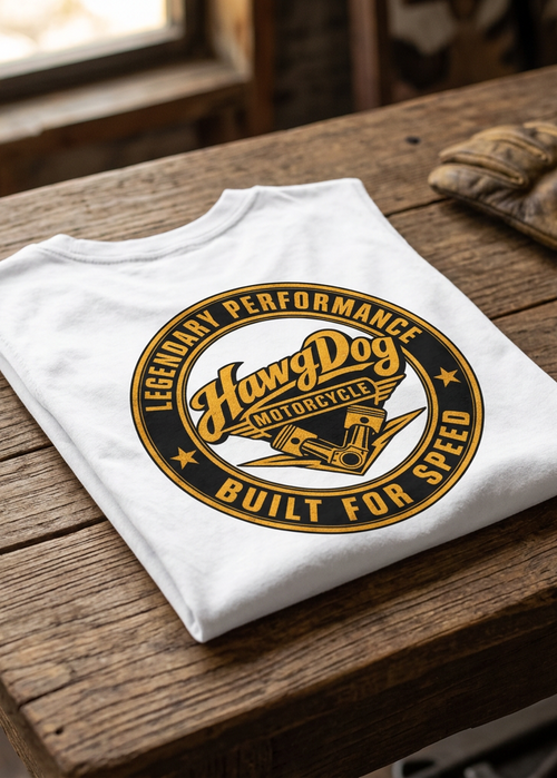 Back of the white Betty Big Twins men's tank top with the Built for Speed gold seal, folded on a wooden table