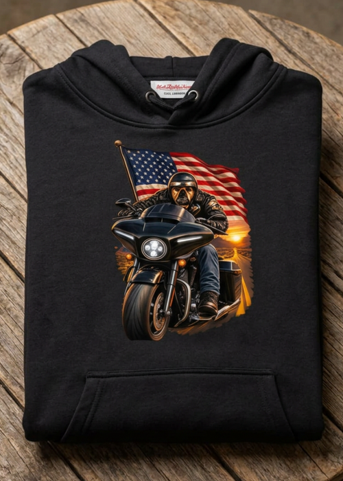 Front of the black American Dog hoodie with the flag bulldog biker graphic, laid flat on a wooden table