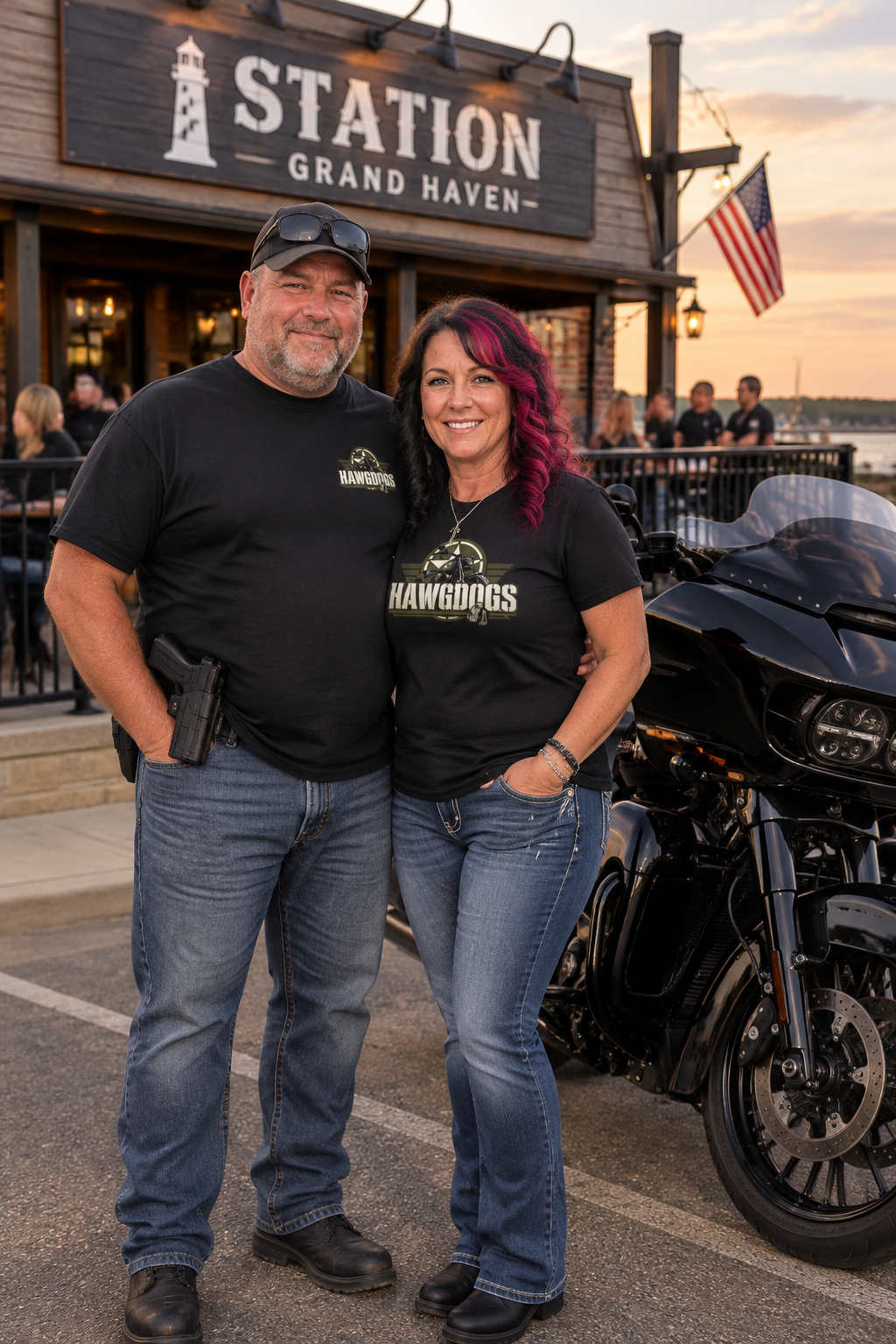 Couple in black Might of The Republic tees at the Grand Haven Coast Guard station