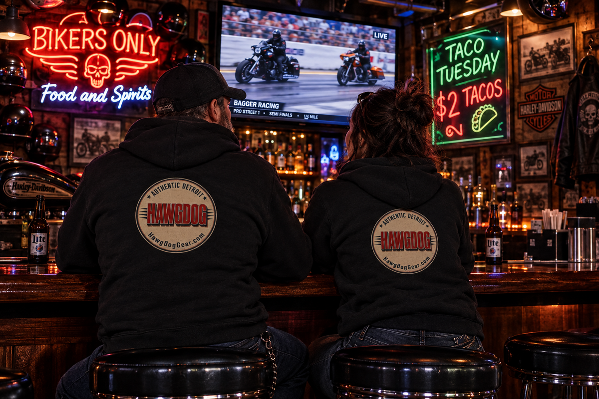 Back of black Bagger Dogs hoodies with the Authentic Detroit patch at a biker bar