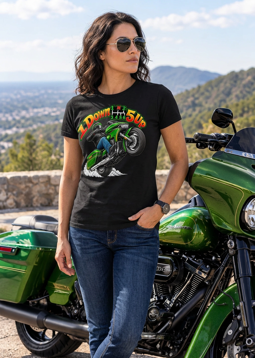 Man in the black Wild Wheelie 1 Down 5 Up tee with a green motorcycle by the lake